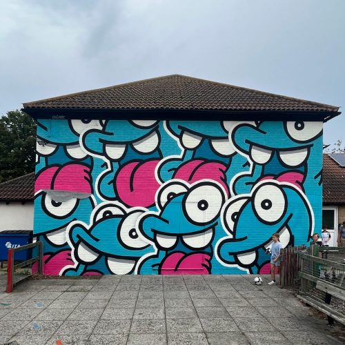 Look up NOL Nolart streetart graffiti mural character design happy Portsmouth Southsea sticker pile